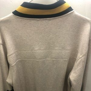 100% cotton fabric oat meal color varsity jacket.pretty warm durable. Like new